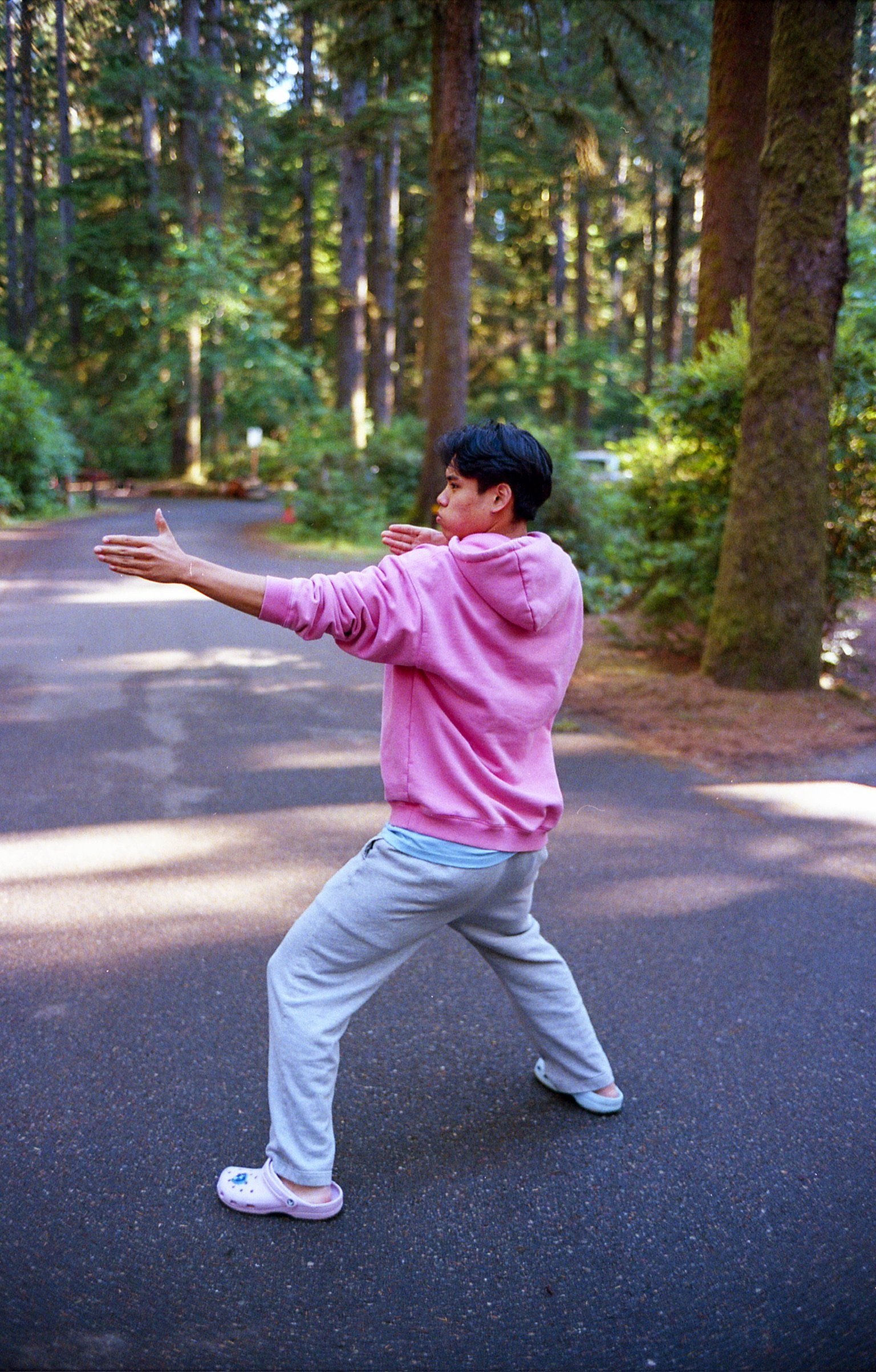 Kenny Bae in a pink hoodie